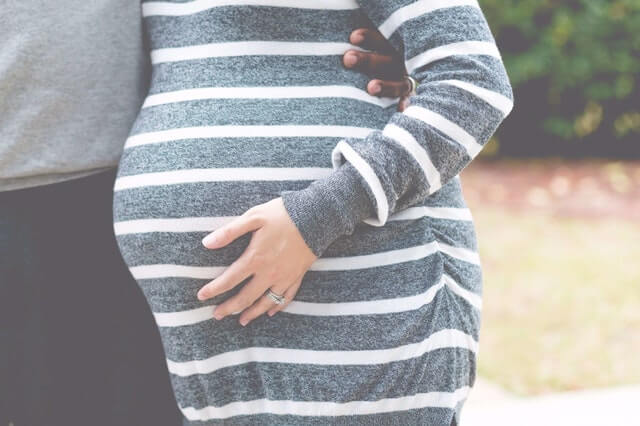 Husband and wife preparing for baby on a budget.