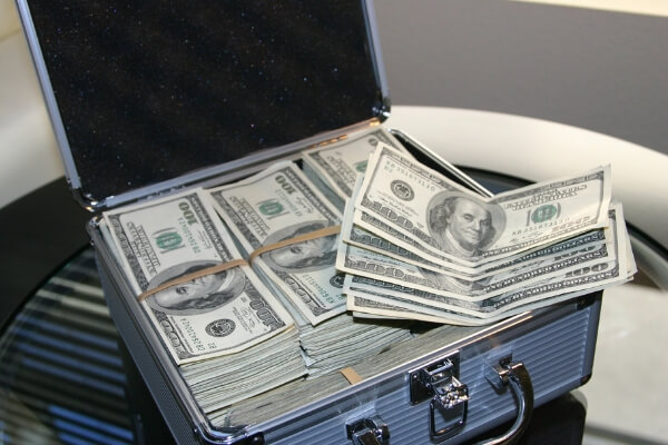 Creative ways to save money, money in briefcase. 