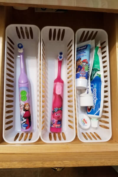 White bins used for bathroom organization for your drawers. 