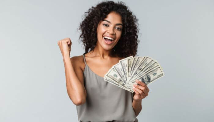 women happy with cash