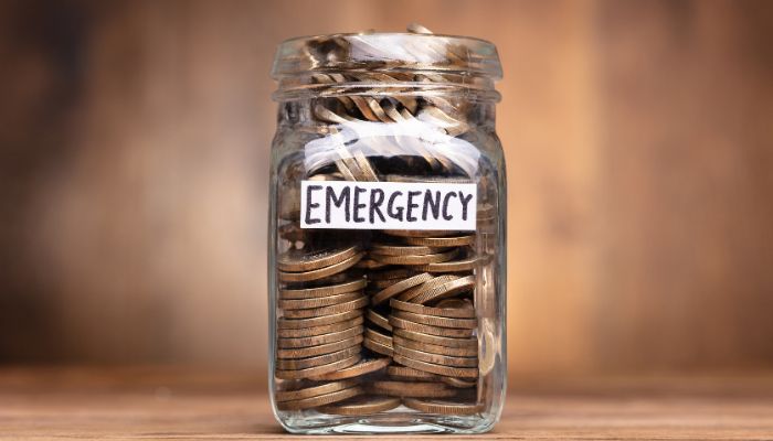 jar with money saving for an emergency fund